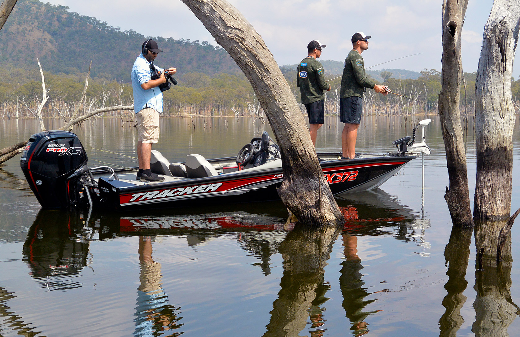A team of AFC Outdoors competitors work the standing timber at Eungella in search of sooties for the TV cameras.