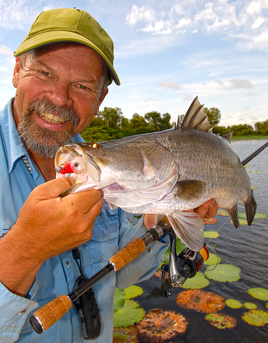 Starlo with a nice barramundi, pulled from amongst the lilies at Corroboree Billabong. Starlo with a nice barramundi, pulled from amongst the lilies at Corroboree Billabong.