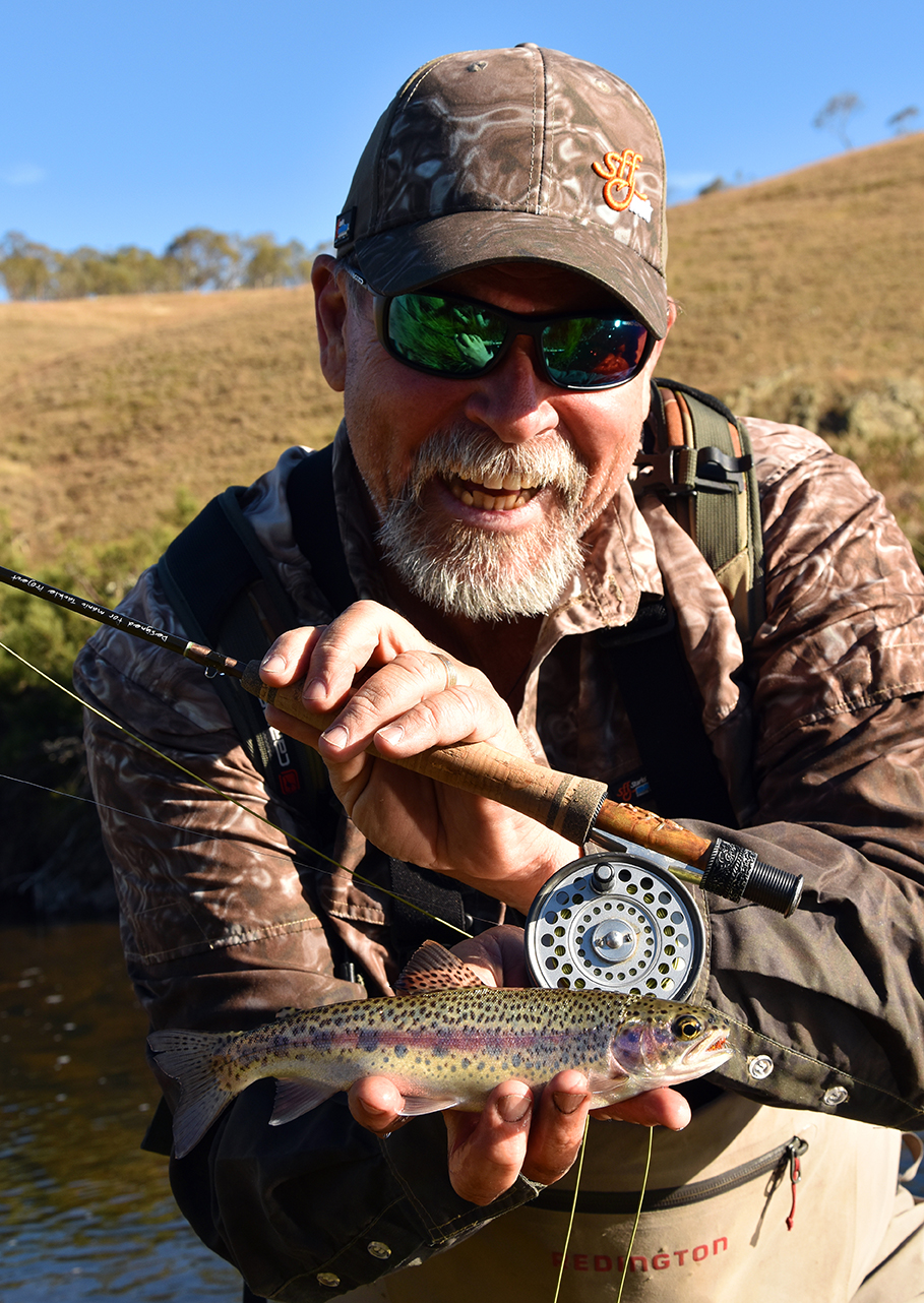 Steve Starling shows off a small rainbow trout, pulled from a stream around Tantangara Reservoir.