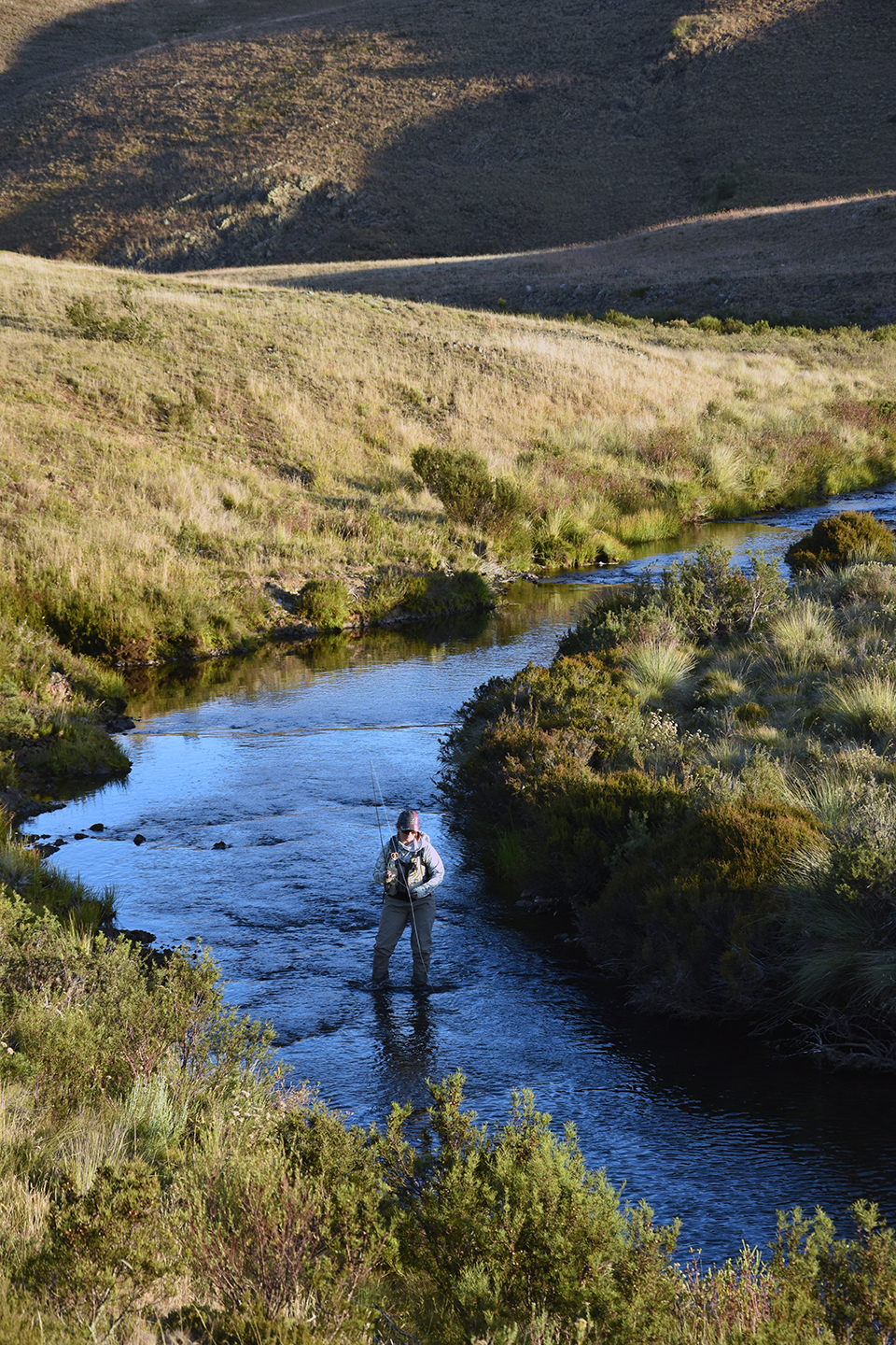 Jo Starling fly fishing in a quiet stream, upstream of Tantangara Reservoir.